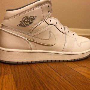 All white high top air Jordan 1’s